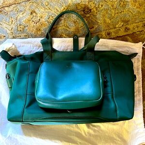 Monos green duffle with tech bag, shoulder strap, and dust bag